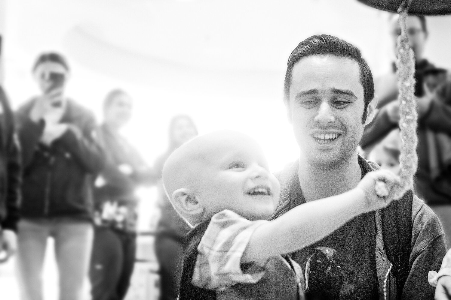 boy and dad rining bell for last chemo session at johns hopkins .jpg