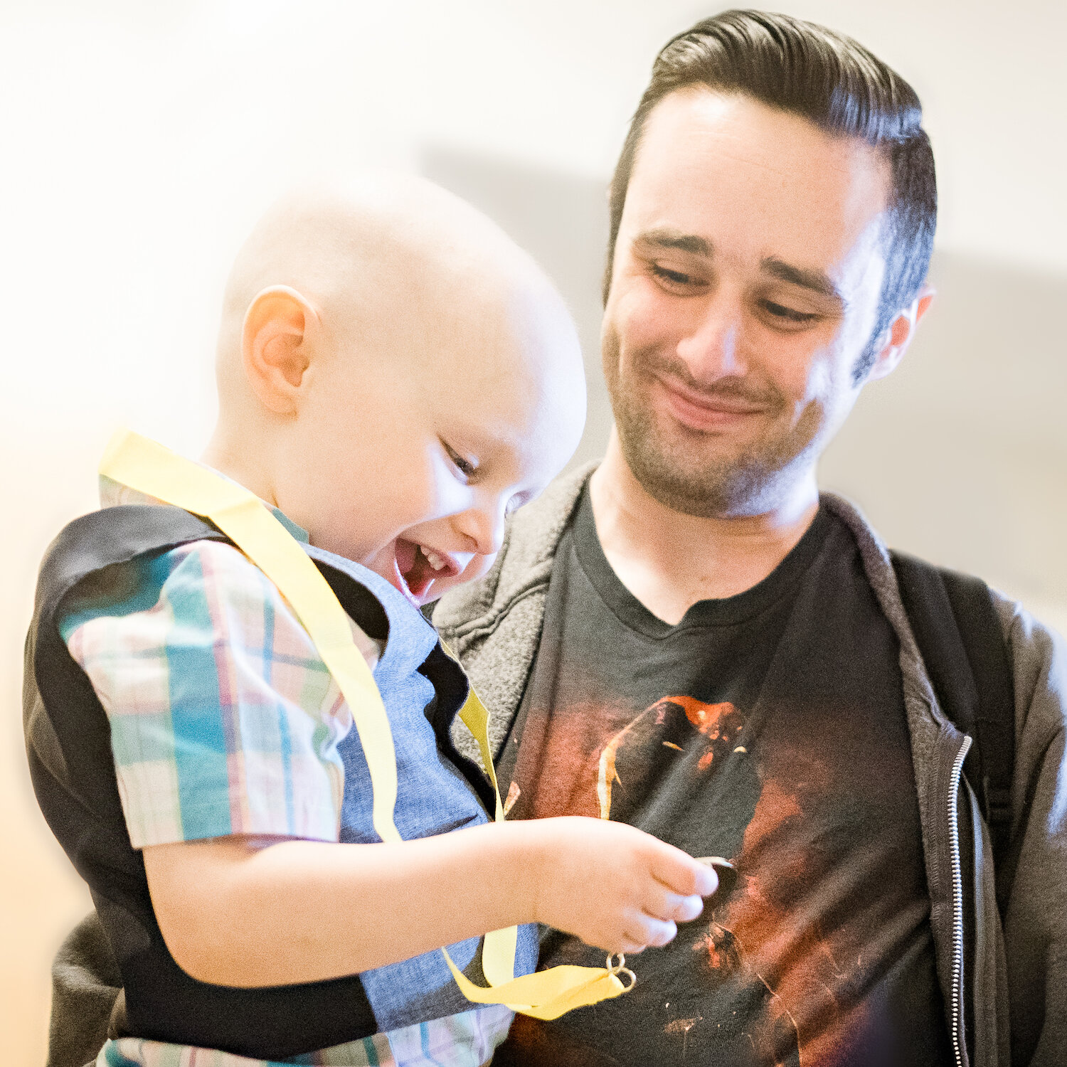 father-and-son-celebrate-boys-completing-chemo-at-johns-hopkins-childrens-center.jpg