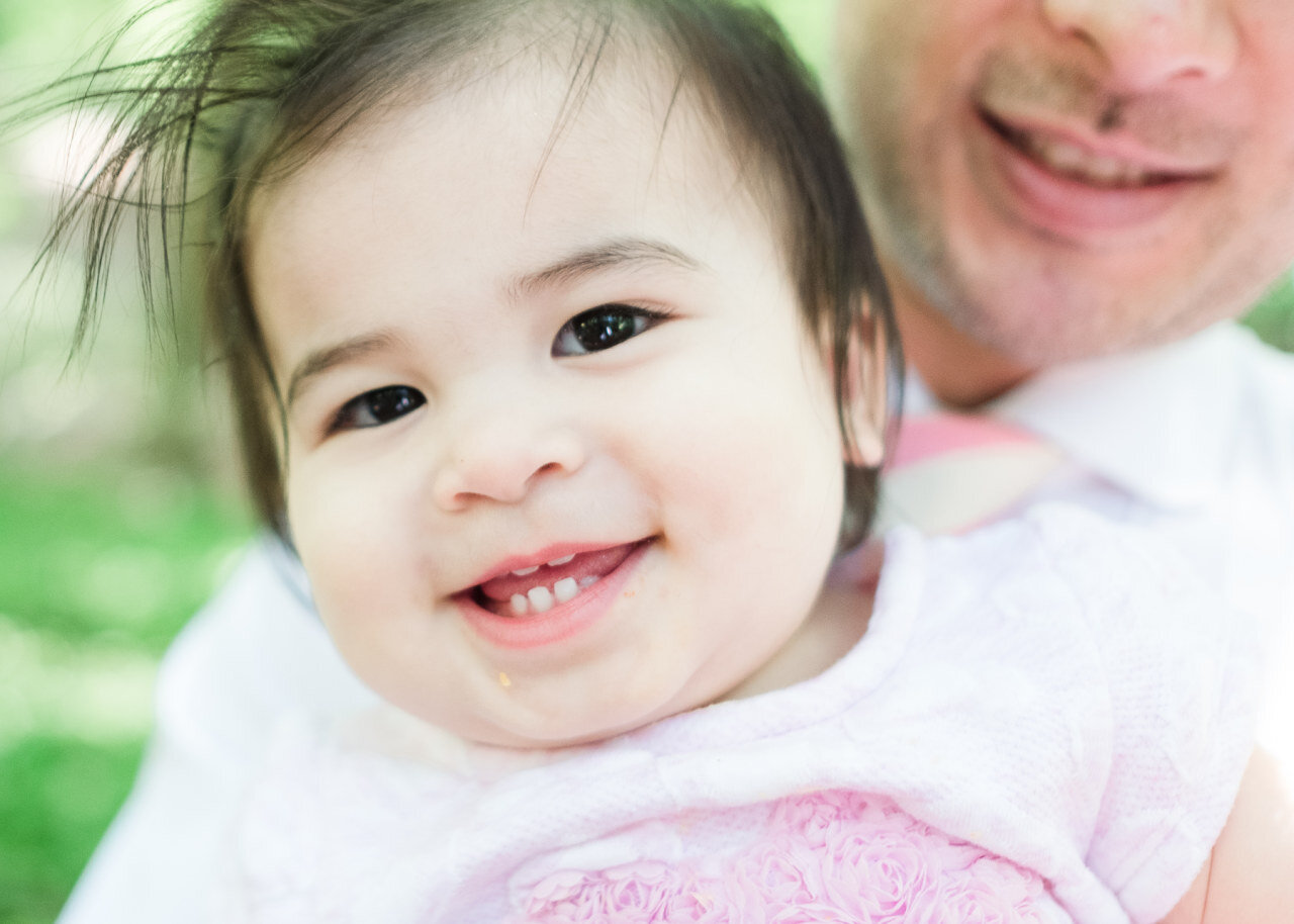 beautiful-one-year-old-child-smiles-showing-teeth.jpg