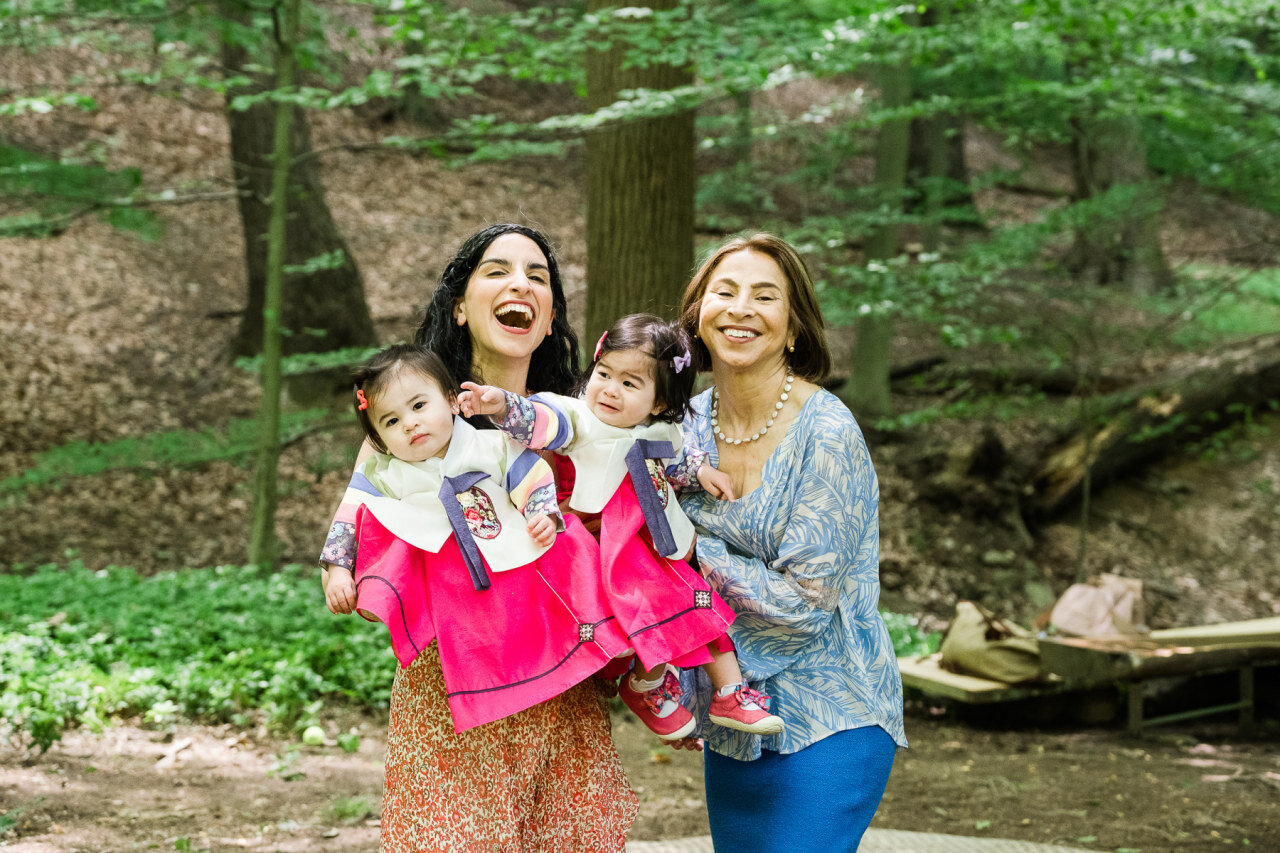 mother-and-daughter-hold-twin-grandaughters-on-their-birthday.jpg