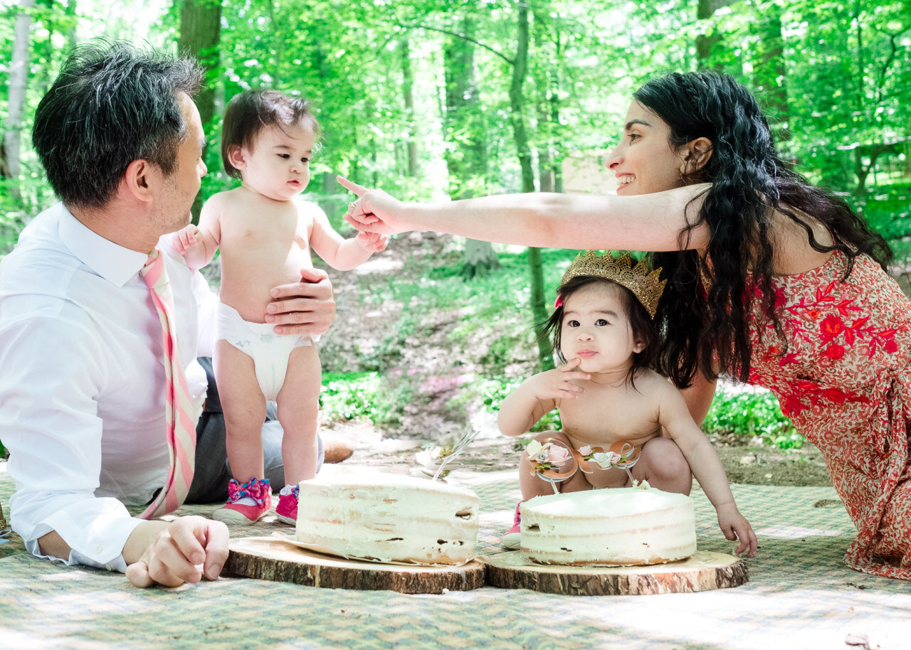 parents-sharing-cake-with-daughters-at-birthday-celebration.jpg