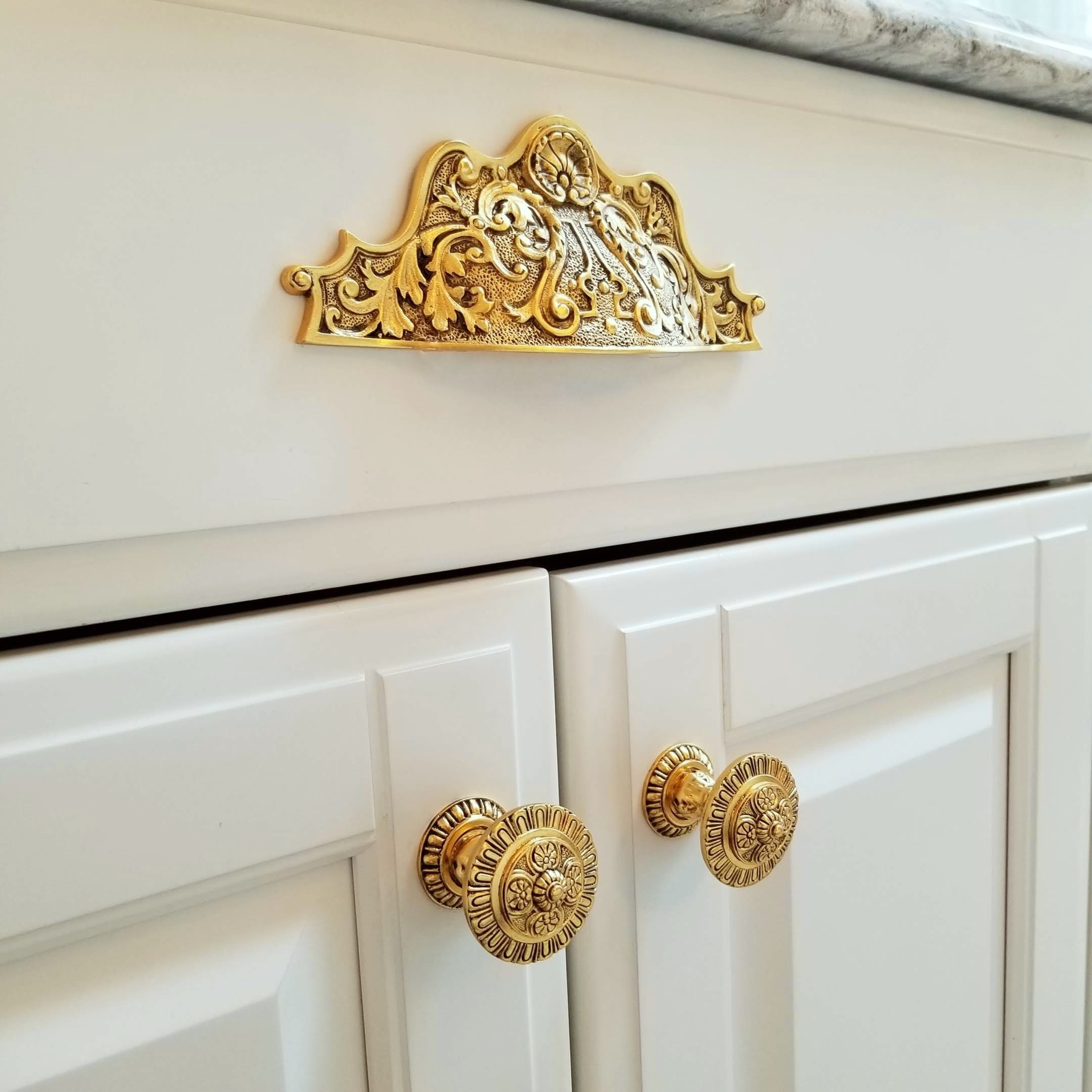 Kensington bin pull and knobs and back plates in 24K gold finish.jpg