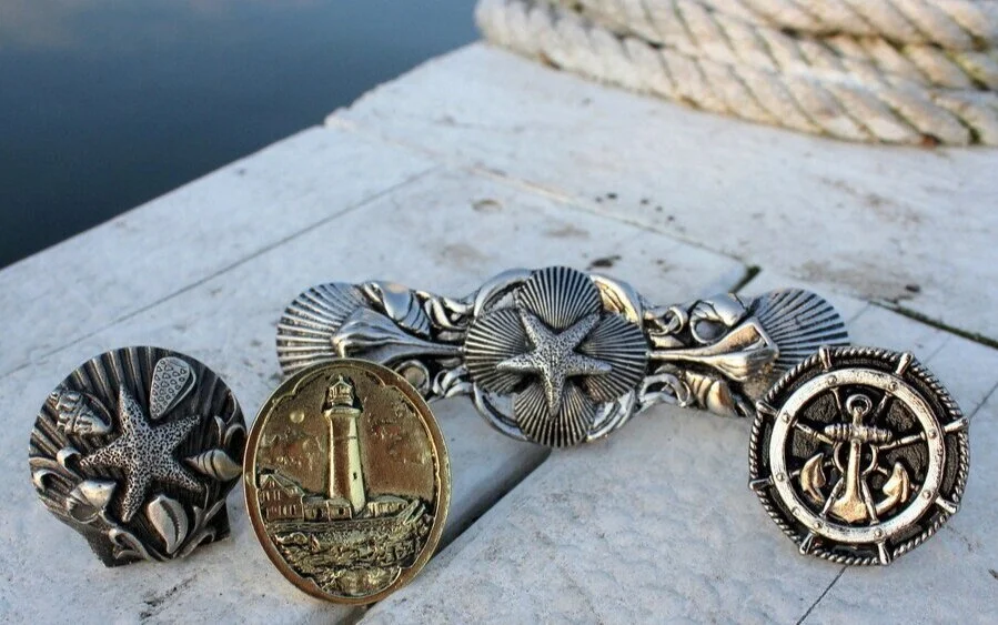 6+American+made.+Quality+craftsmanship.++Seaside+Collage+Knob+NHK-134-AP....jpg