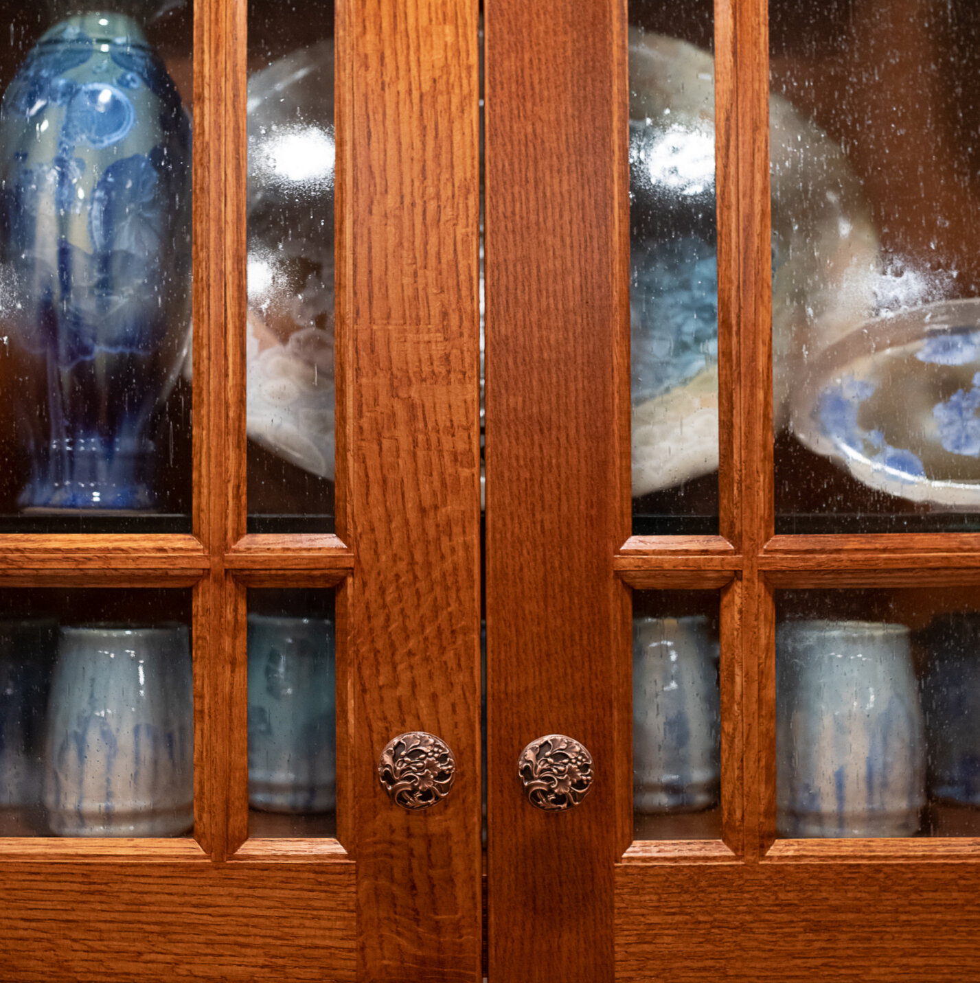 Seeded glass cabinets above coffee bar