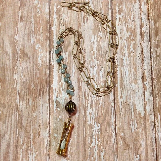 Hourglass pendant with gold chain.jpg
