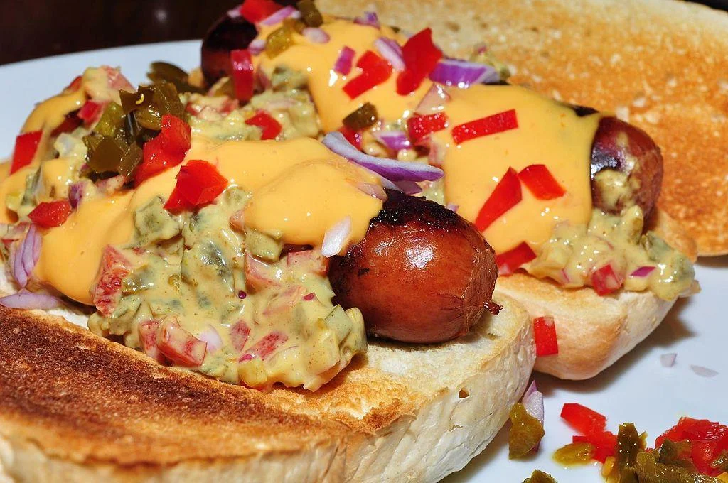 Hot_dogs_with_mustard_relish_and_cheese_sauce.jpg