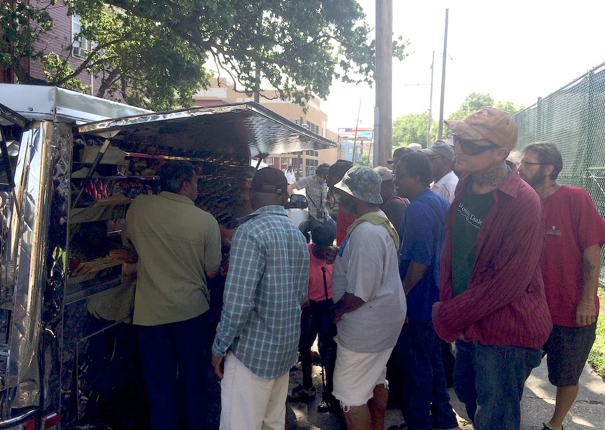The Trinity Loaves and Fishes mobile food truck serving on the corner of Oretha Castle Haley Boulevard and Clio Street in Central City. POPPY TOOKER