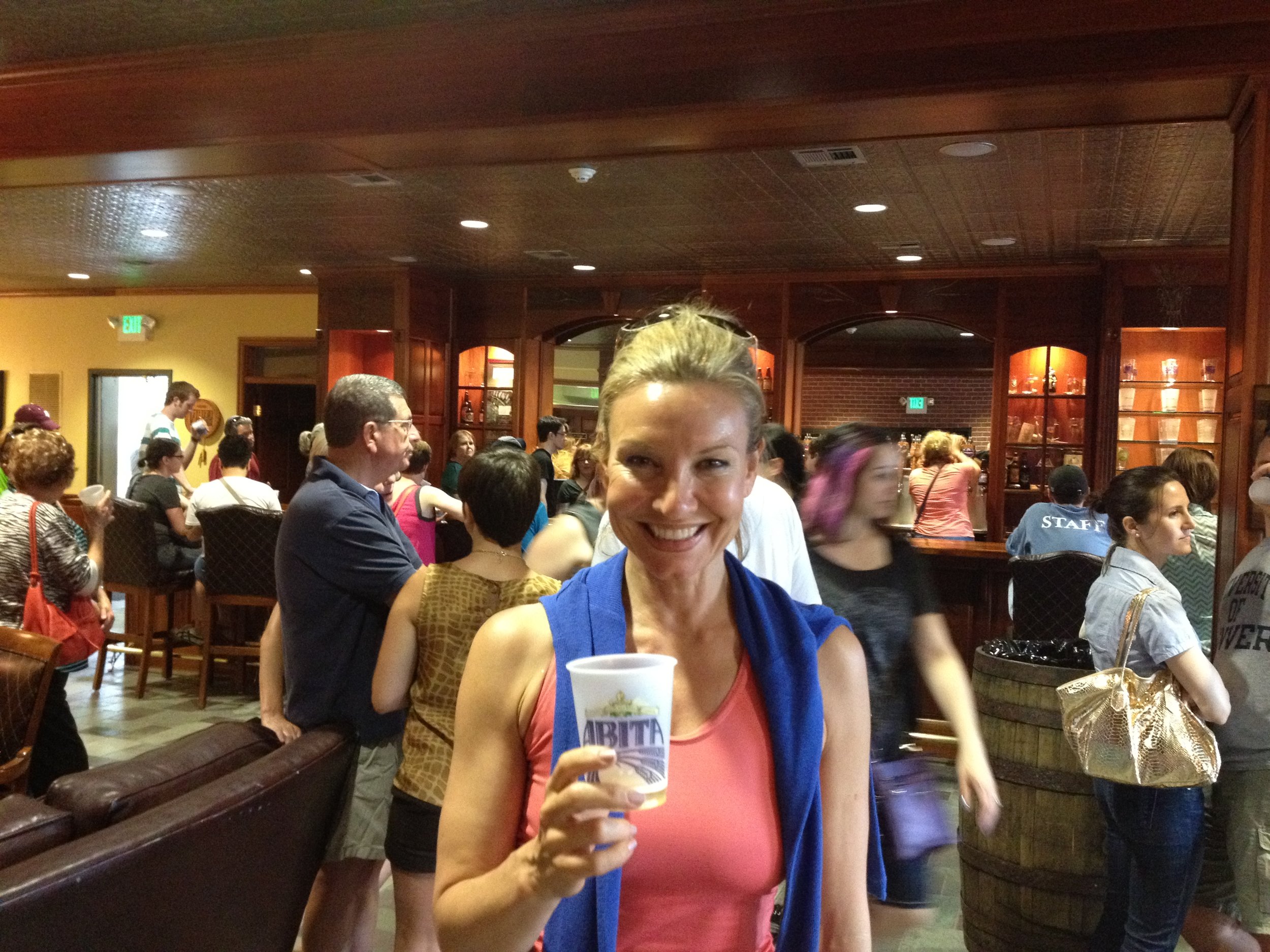 Lively craft beer enthusiasts in high spirits at the Abita Brewing Company Tasting Room.JPG