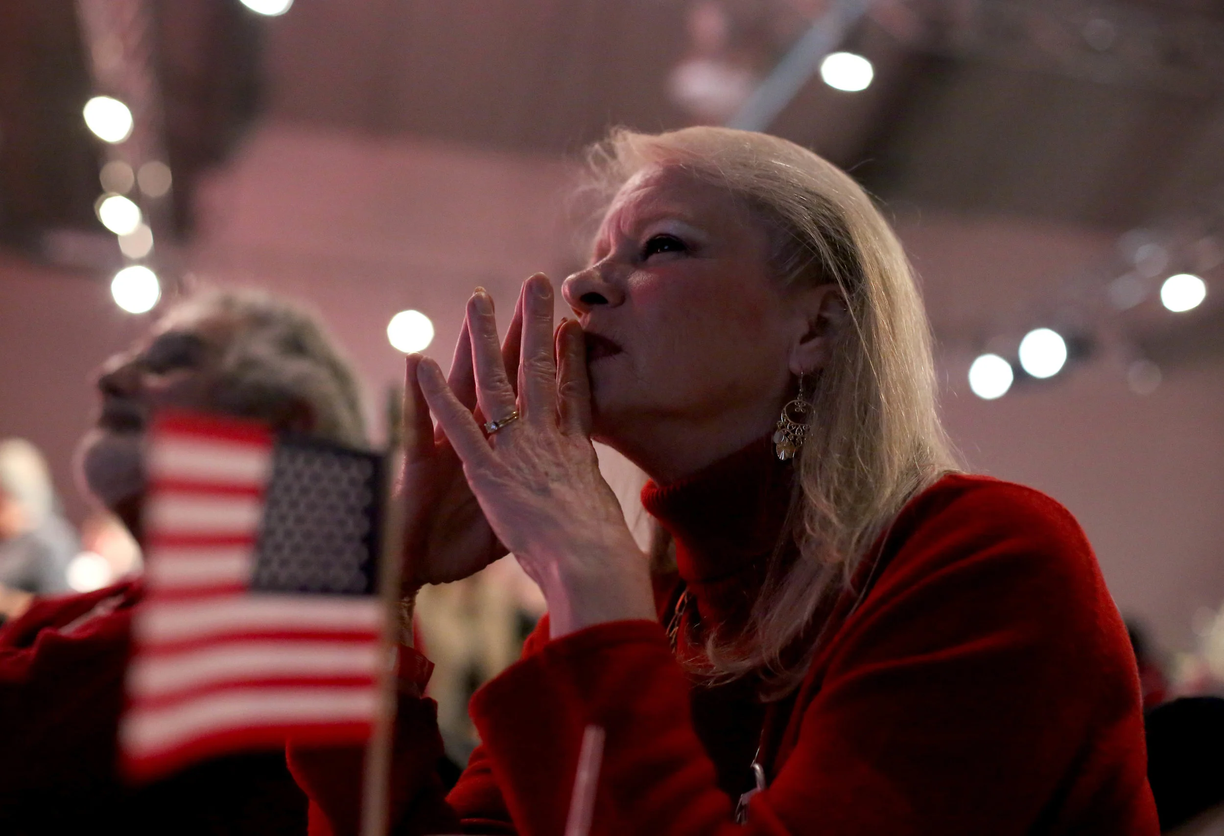 Diane LaRaiea, 64, reacts to Fox News election results during the Massachusetts Trump-Pence Campaign victory party at the F1 Boston race track in Braintree, Mass. Supporters gathered to watch live polling results and cheer for Donald J. Trump as he was elected the next president of the United States on Nov. 8, 2016.