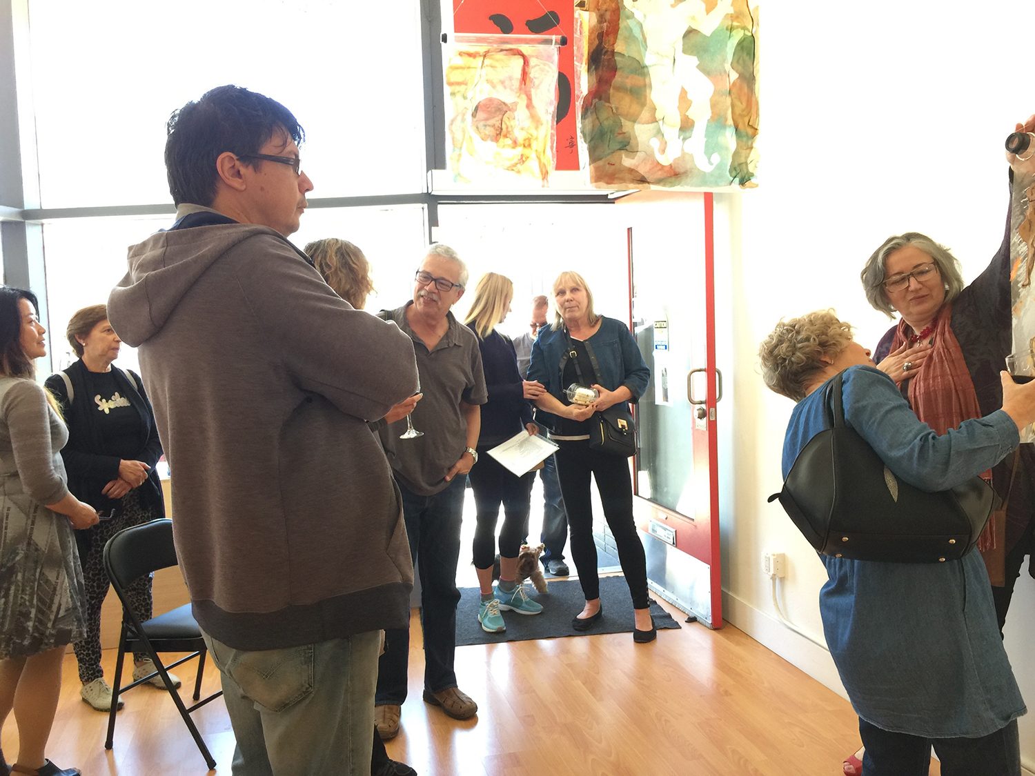 Rita demonstrates how a piece of art changes if you view it from the opposite side.