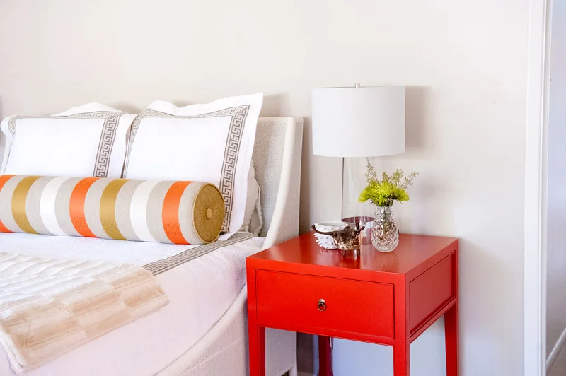 master-bath-red-nightstand-bed-pillows.jpg