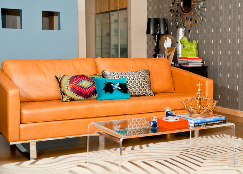 orange-leather-sofa-acrylic-coffee-table.jpg
