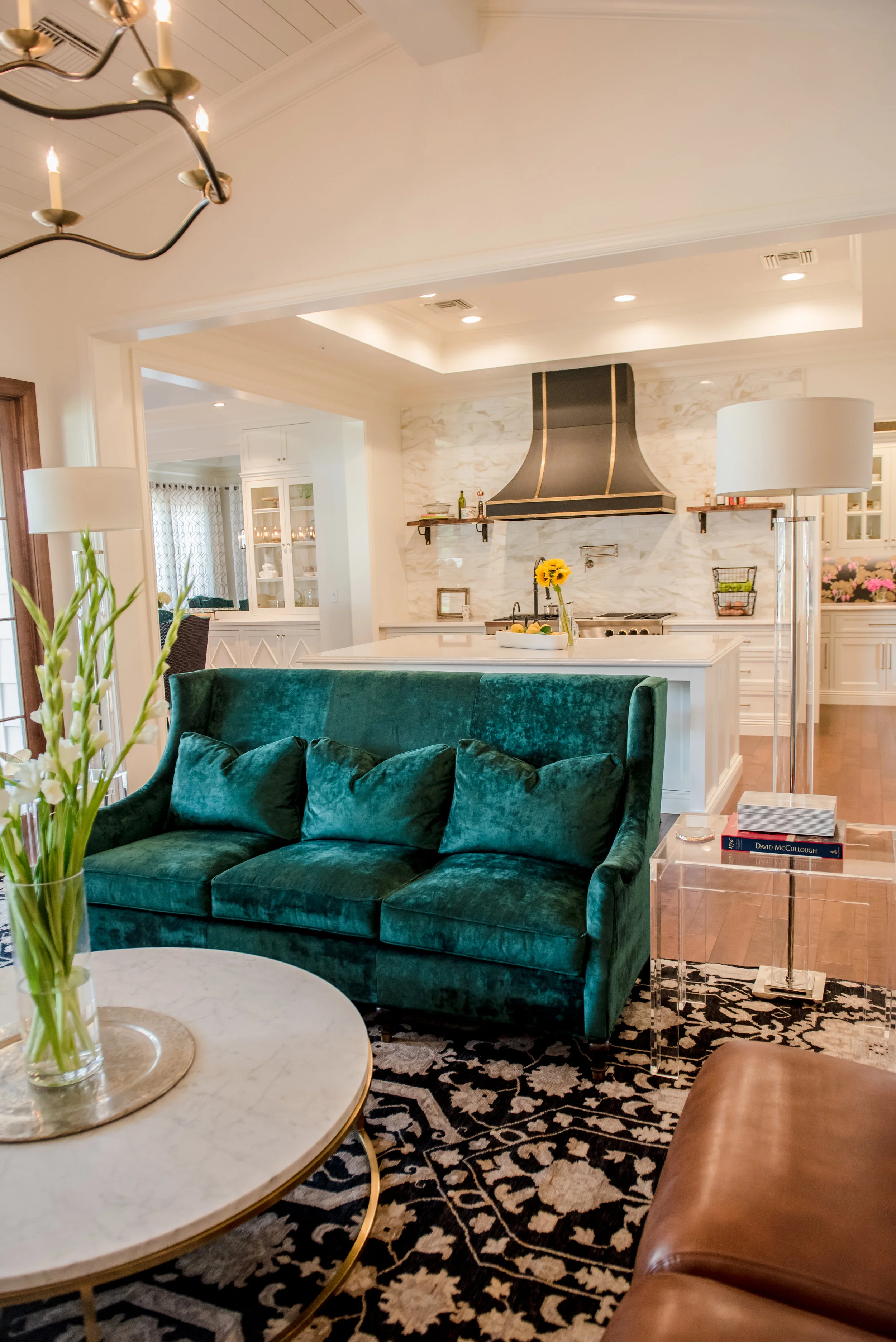 8+LivingRoom+GreenSofa+Marble+PersianRug+Leather+Chandelier+Traditional.jpg
