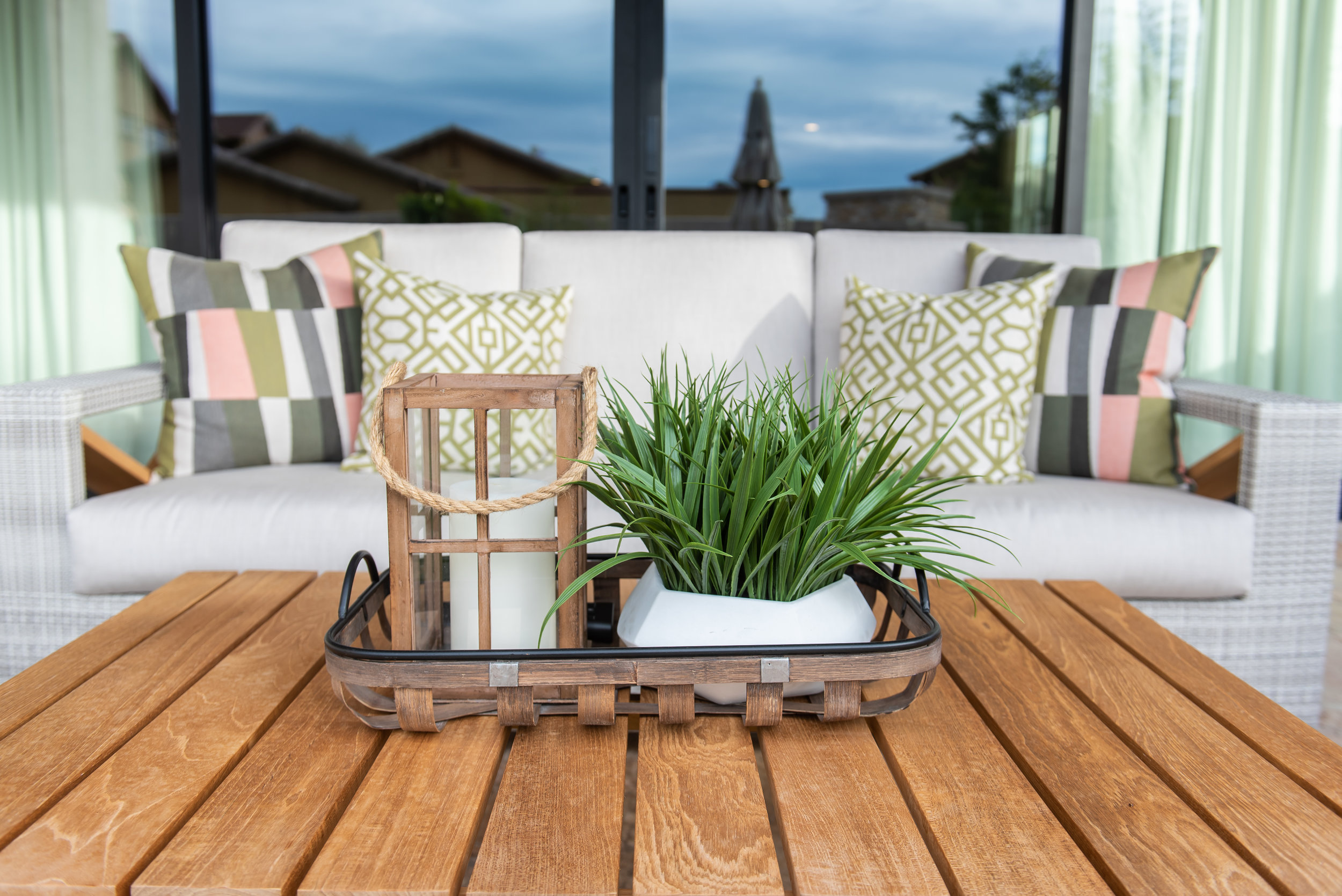 Backyard +patio +outdoor +furniture +pillows +coffeetable +plant.jpg