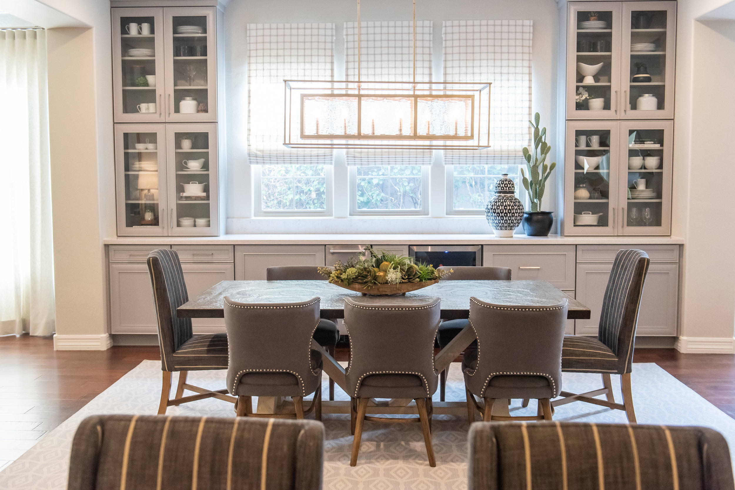 Diningroom + Built-in cabinets +chandelier +roman-shades +nailhead +dining-chairs.jpg