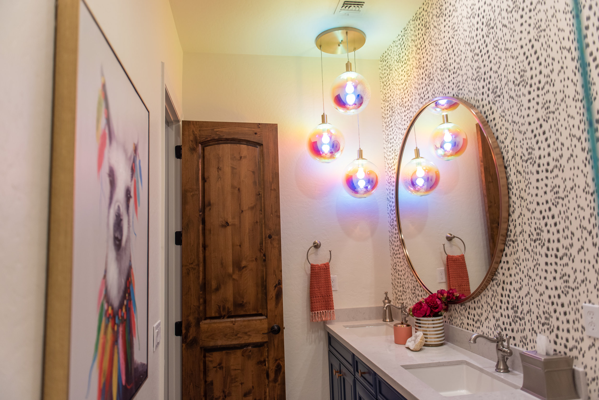 girls bathroom +round +mirror +wallpaper +lighting +artwork.jpg