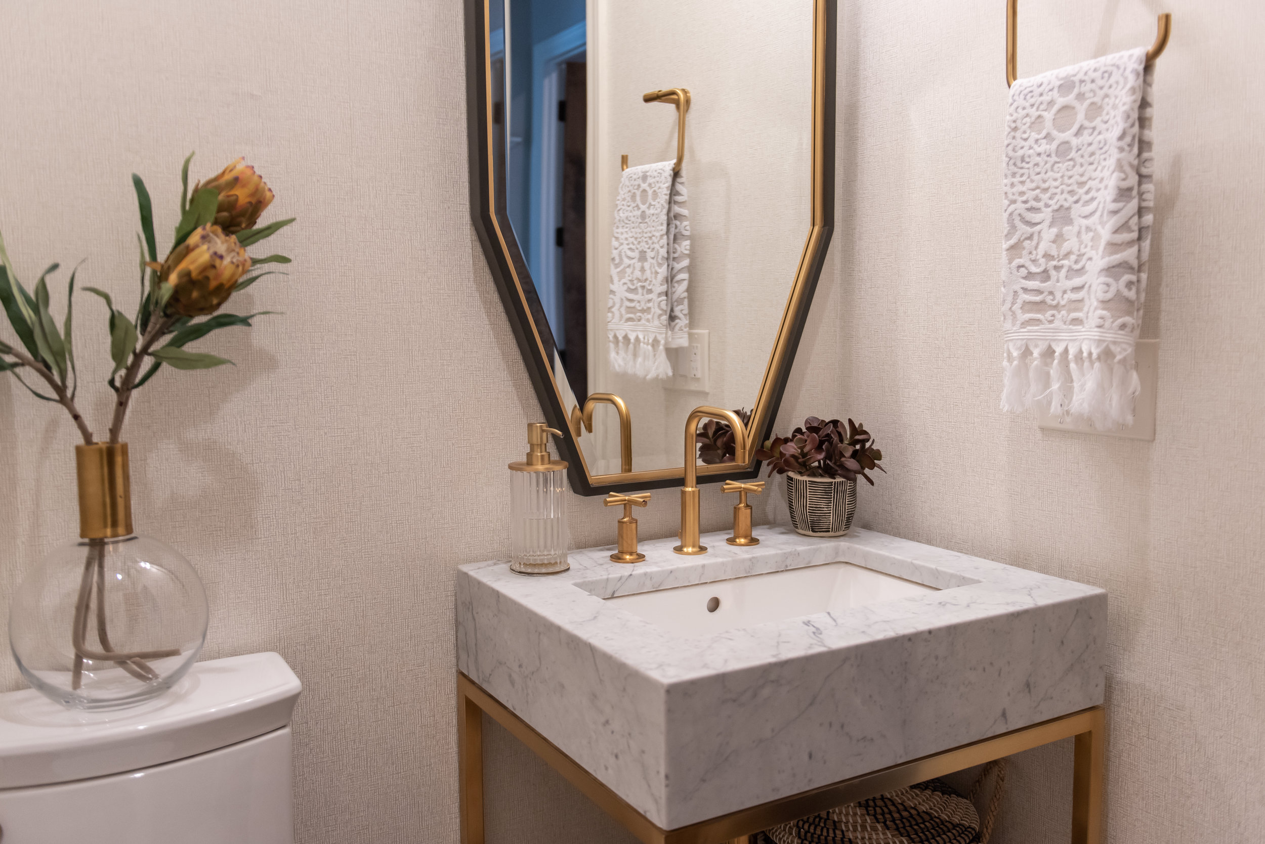 powder bathroom +octagon +mirror +brass +marble +countertops.jpg