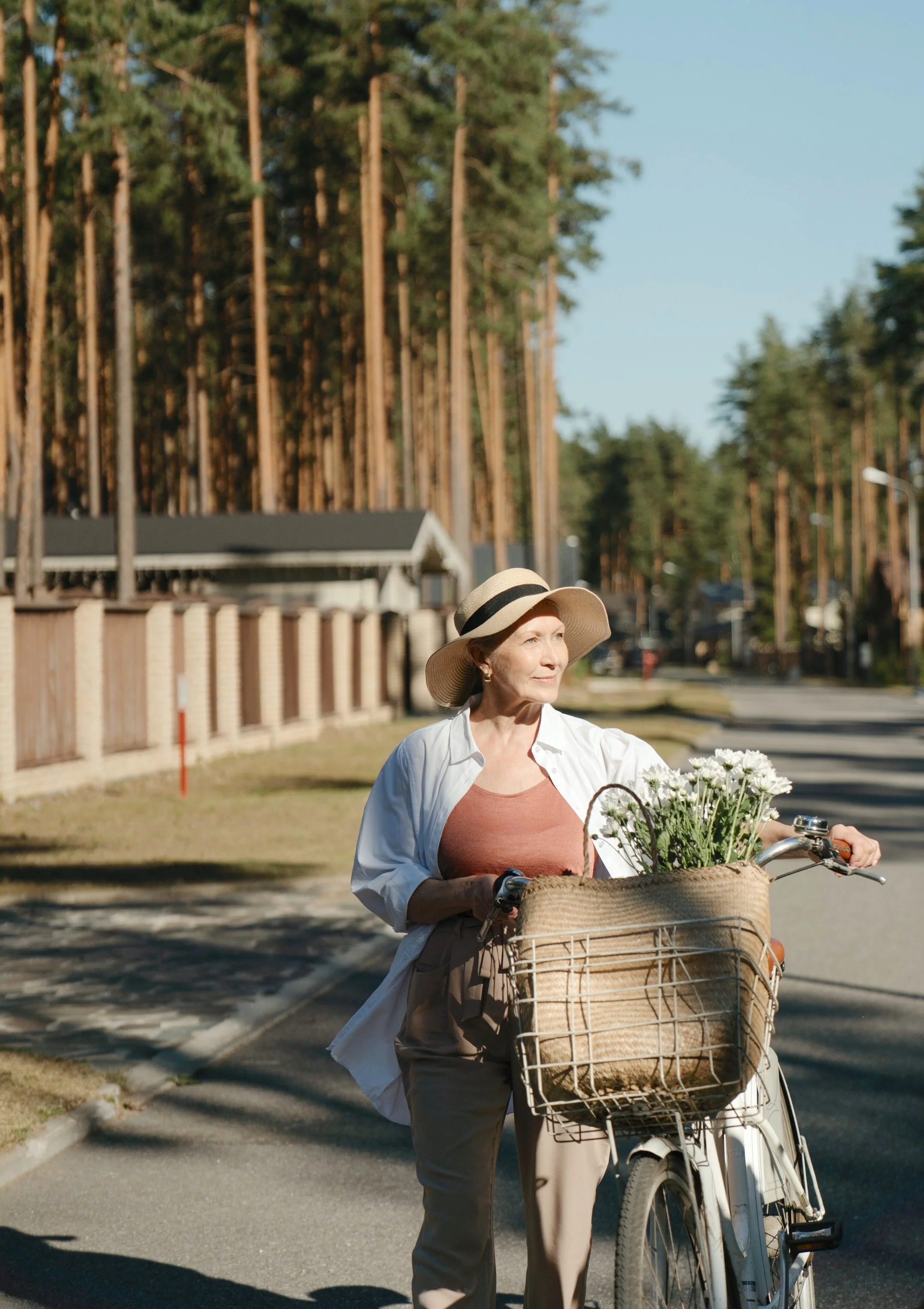 An elderly woman enjoying a peaceful bike ride