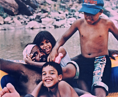 Young Arlo - with siblings Emma and Obe and father Jose - falling in love with the river.