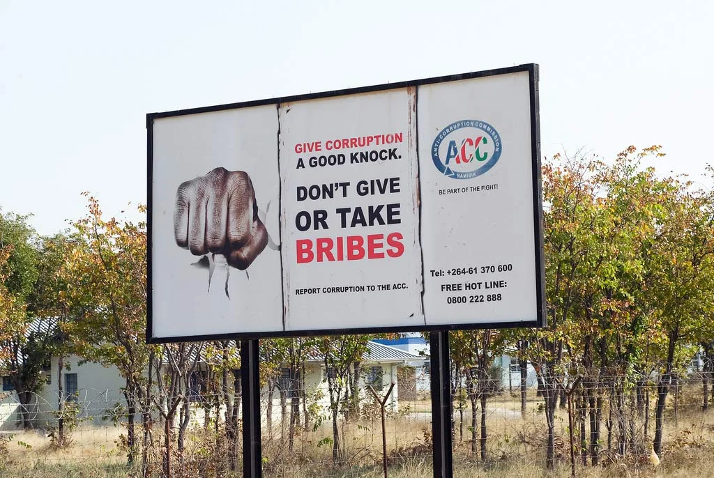 The Global Compact’s 10th Principle asserts that businesses should work against corruption in all its forms, including extortion and bribery. Seen here is a billboard in Namibia promoting anti-corruption. Photo: World Bank/Philip Schuler