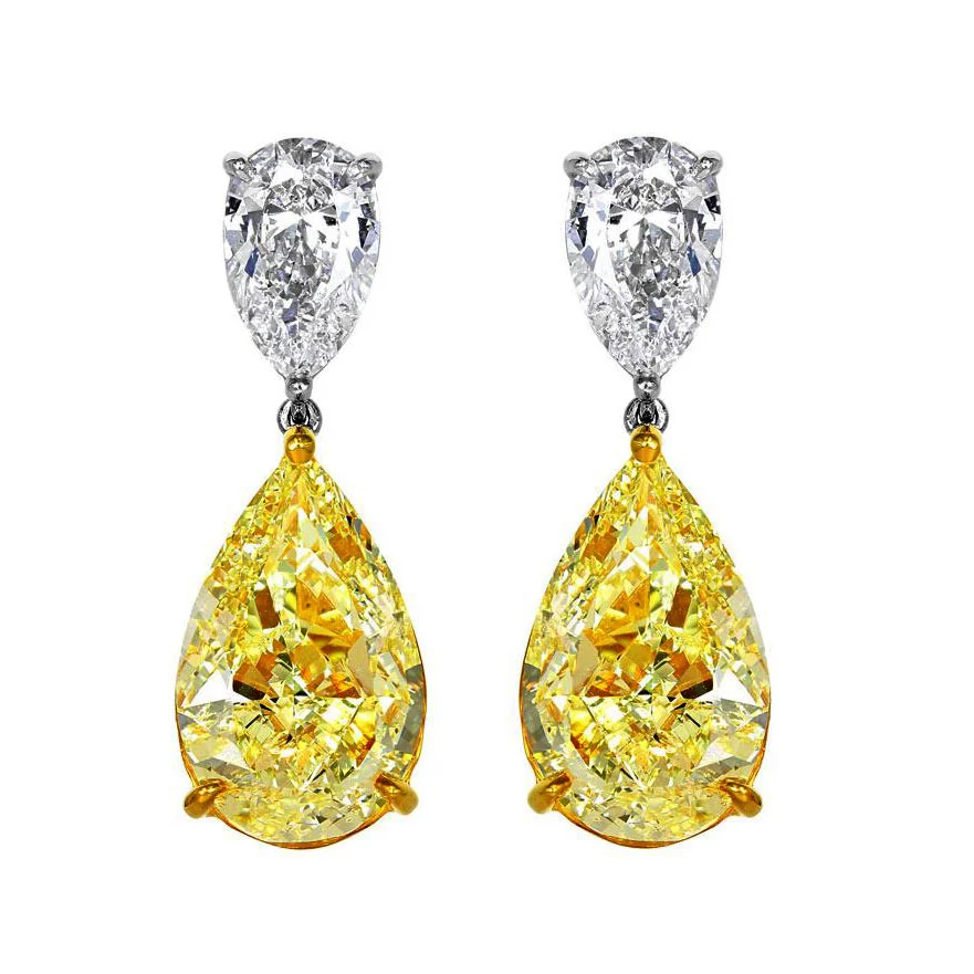 FANCY YELLOW PEAR SHAPE DIAMONDS WITH COLORLESS PEAR SHAPE DIAMONDS CRAFTED IN PLATINUM AND 18K YELLOW GOLD, 10.25 CTW