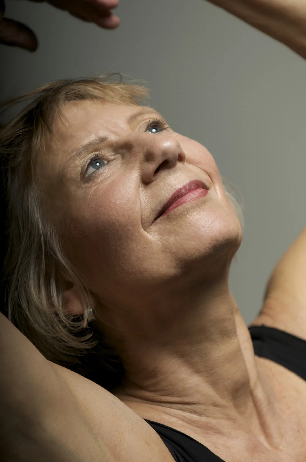 Nina Berne Photo headshot arms up.jpg