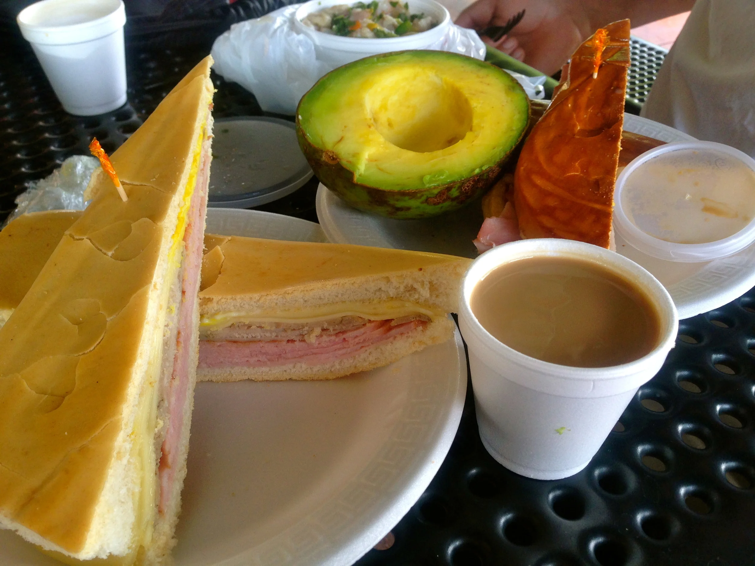 Media noche sandwich, cuban sandwich,huge avocados and cuban coffee, cortadito at the Palacio de los jugos.