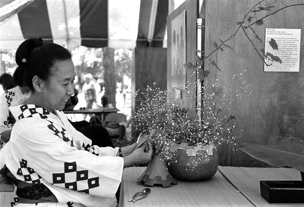 Atsuko Lefcourte demonstrating Ikebana flower arranging at the 1988 Florida Folk Festival