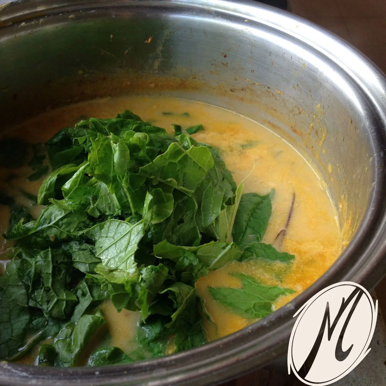 Add the greens once the potatoes have thickened the soup.