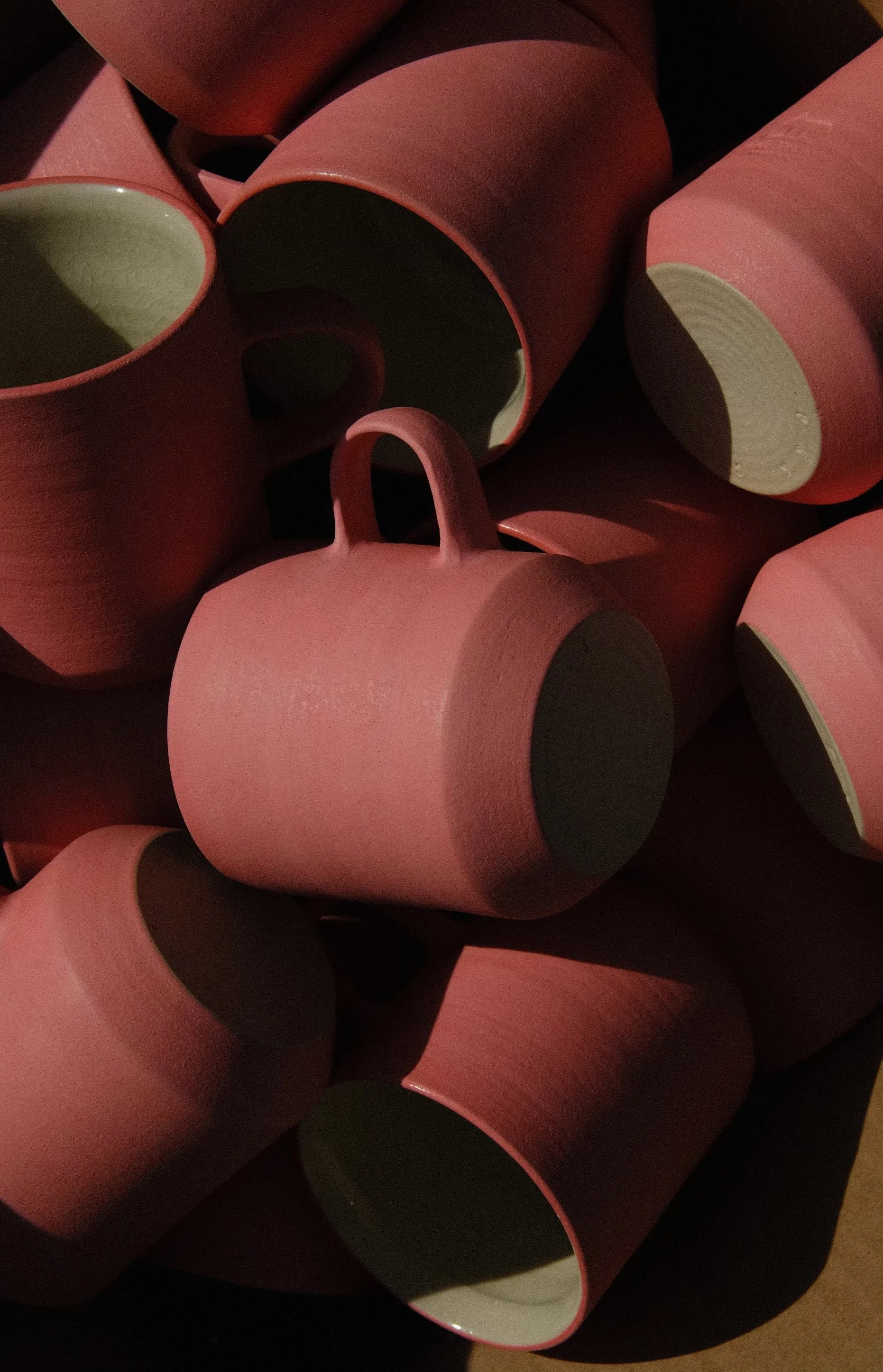 pink-house-alchemy-pkk-pink-mug-pile-back.jpg