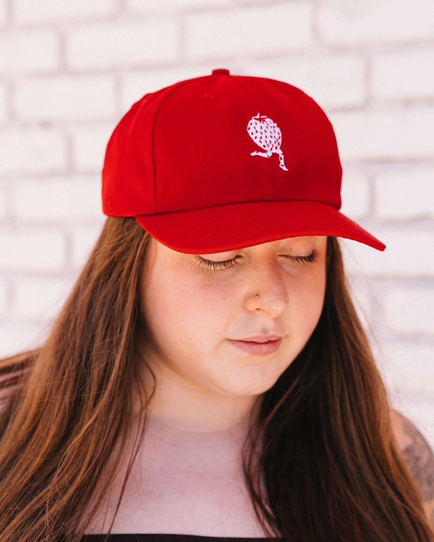 Say hello to summer with our new Strawberry Hat 🍓 Ruby June is so good she deserved another moment. Stitched with love and ready to wear, these hats are THE ideal way to celebrate summer, sweetness, and all things fresh. Made in the US, sturdy canva
