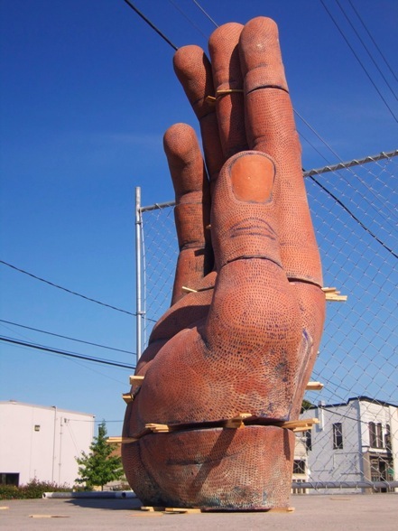  Nine Part Hand. H: 80” Brick Clay, Glaze, Shims; Seattle.