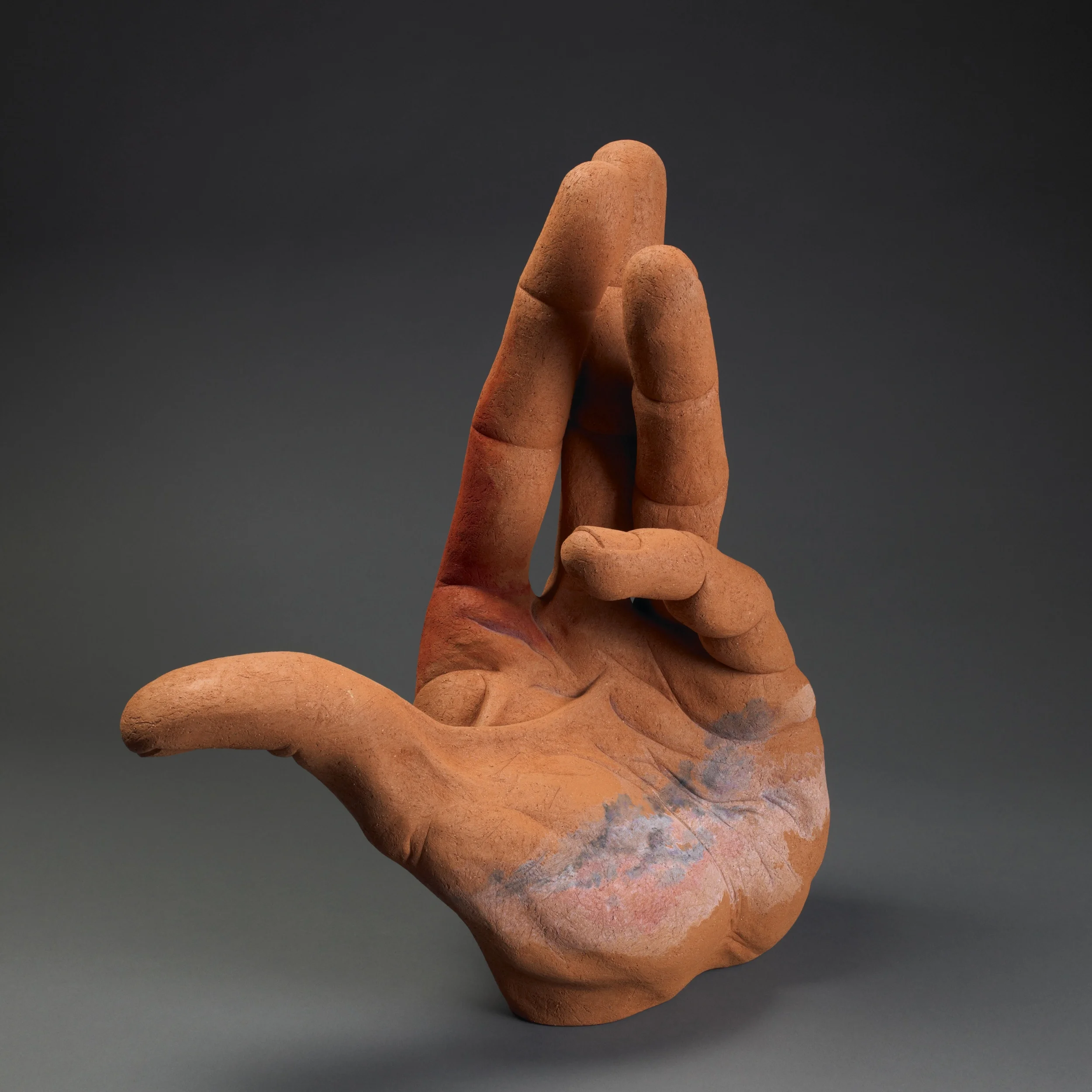  Hand for High Plains. H: 24” Terra Cotta, Acrylic Paint.