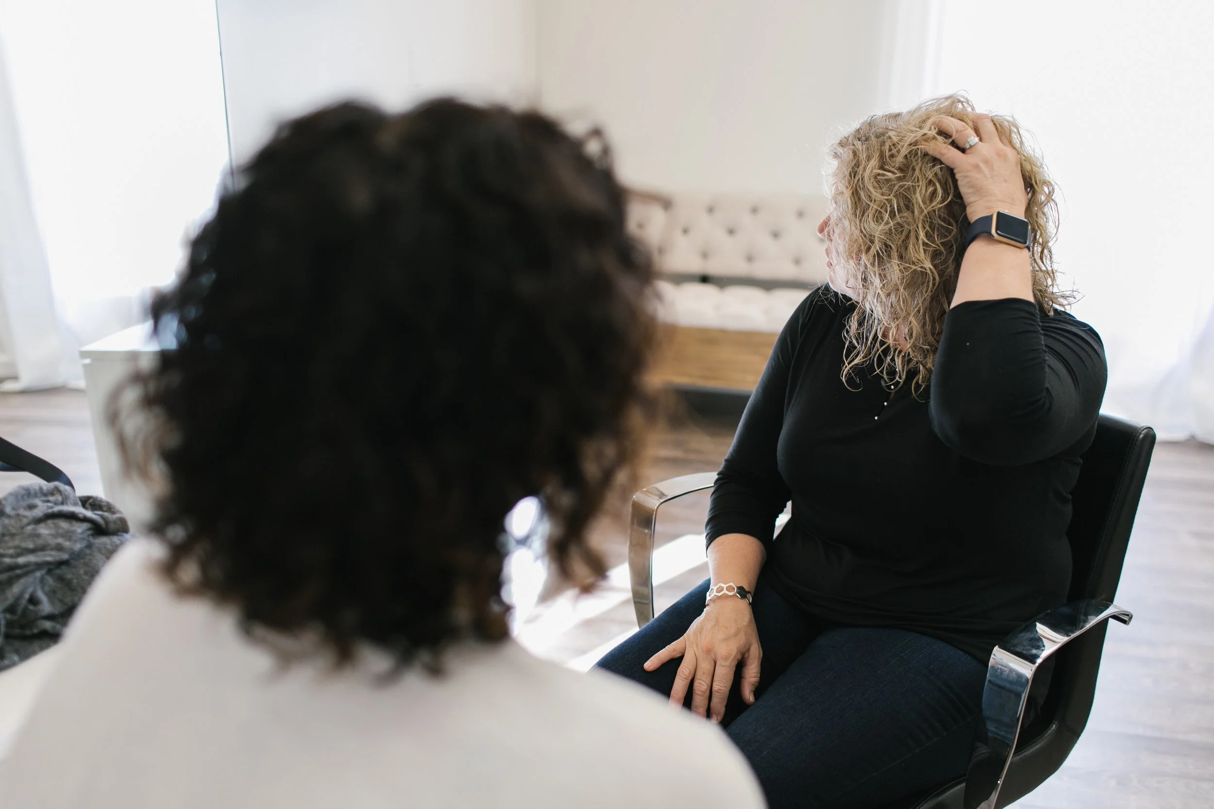 Siren stylist doing a consultation to her client.