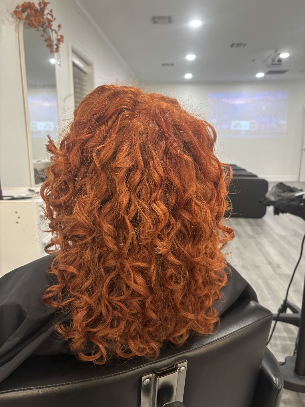 After photo of Jasmine’s client following a Siren Color Session, showcasing gorgeous, all over color on curly hair.