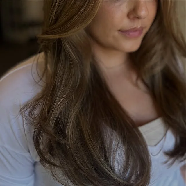 Finished look after a Siren color and cut featuring dimensional highlights and a precision haircut.