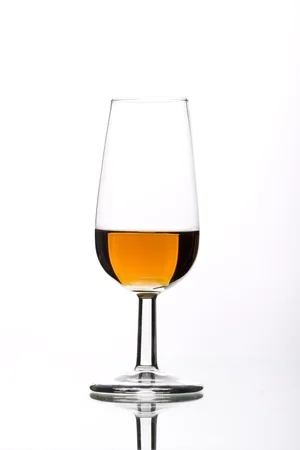 11766015-a-glass-of-wine-from-the-bottle-freshly-cast-Stock-Photo.jpg
