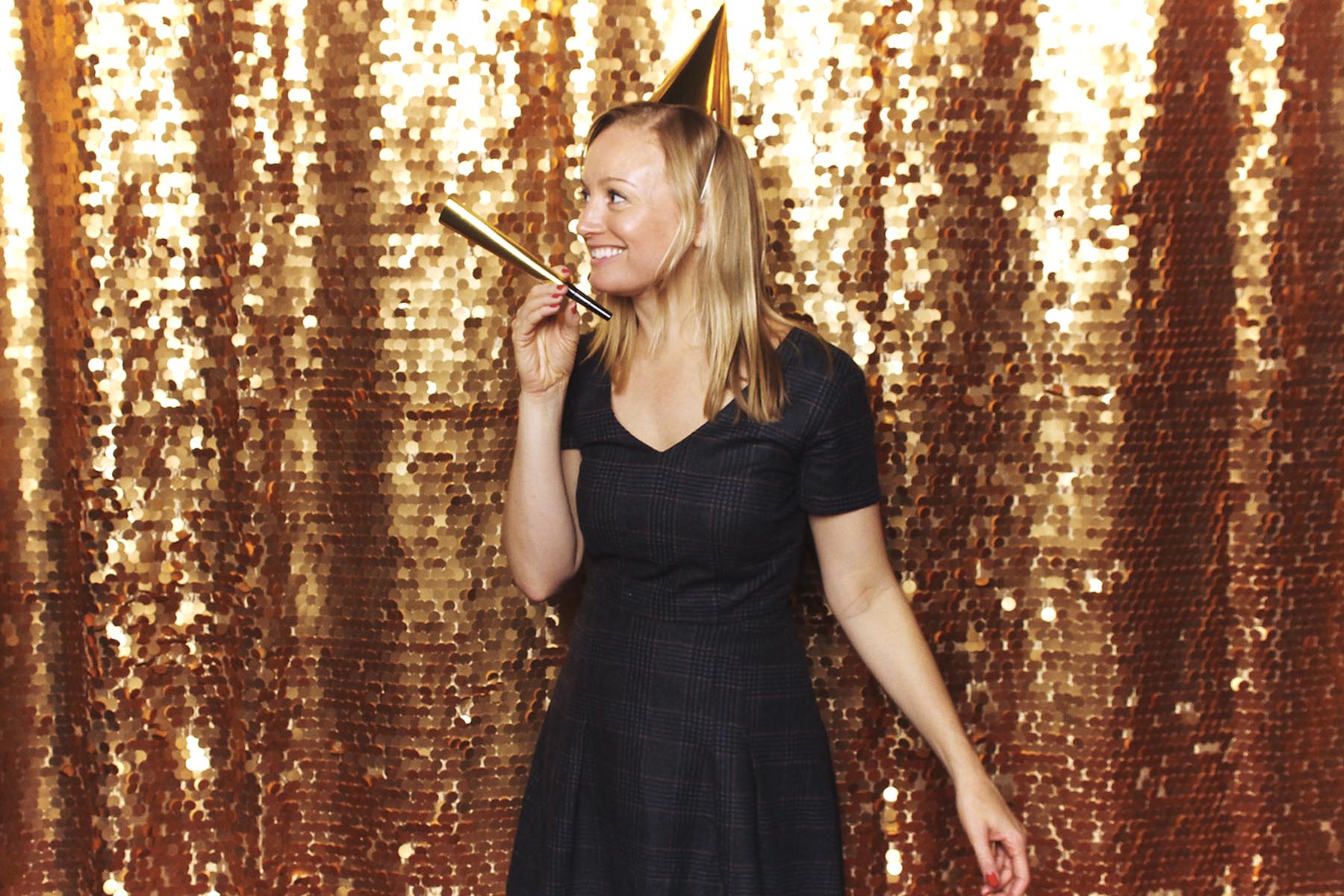 Our Festive Gold Sequin Backdrop is always a big hit!
