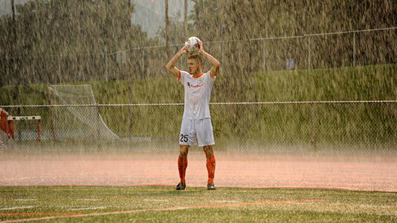 Juan Gatti plays through the extremely wet conditions at Dietz Stadium. (Photo by Roy Gumpel )
