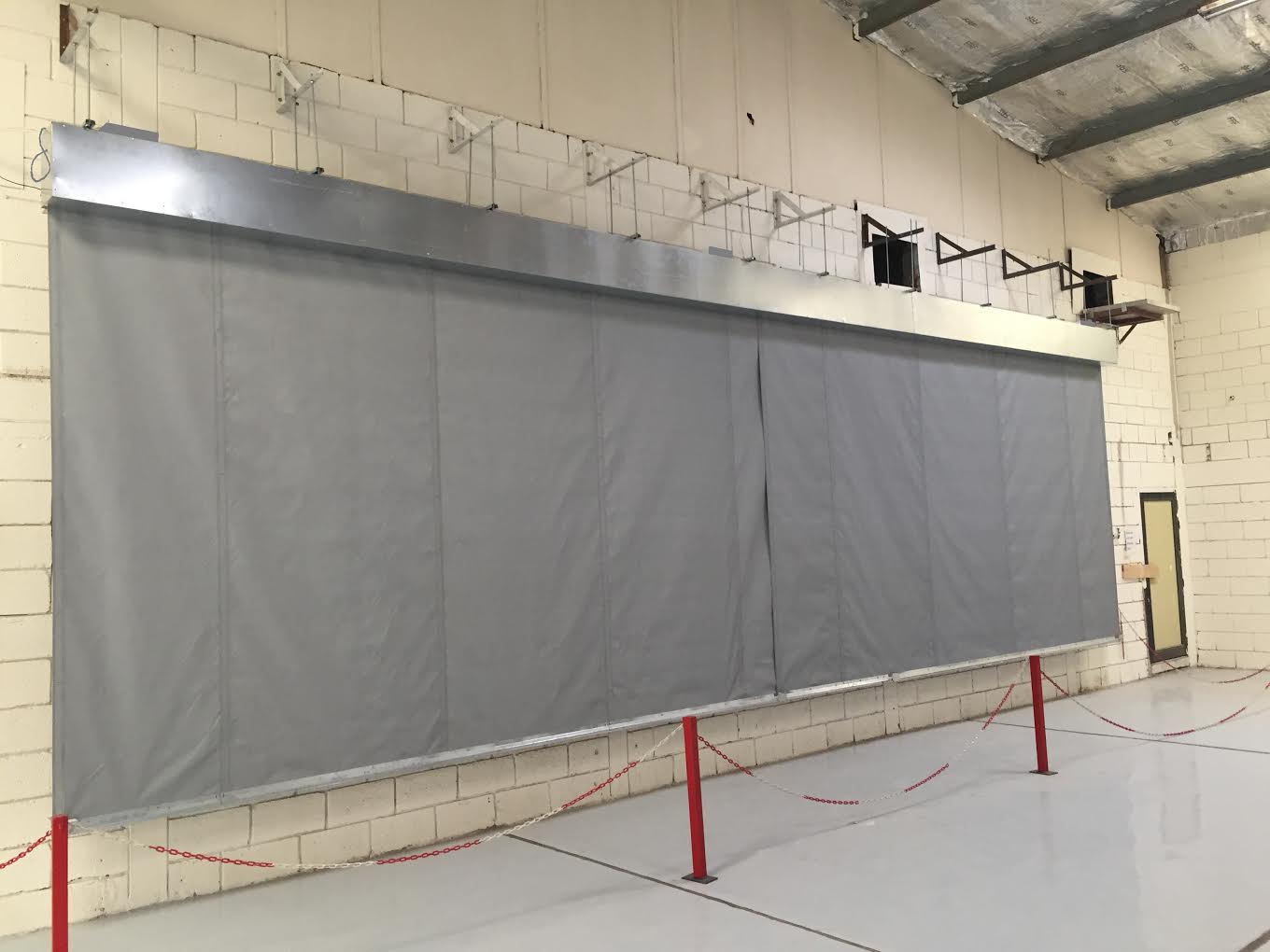 10m wide x 3m drop smoke curtain undergoing cycle testing to BS EN 12101-1:2006 Annex B