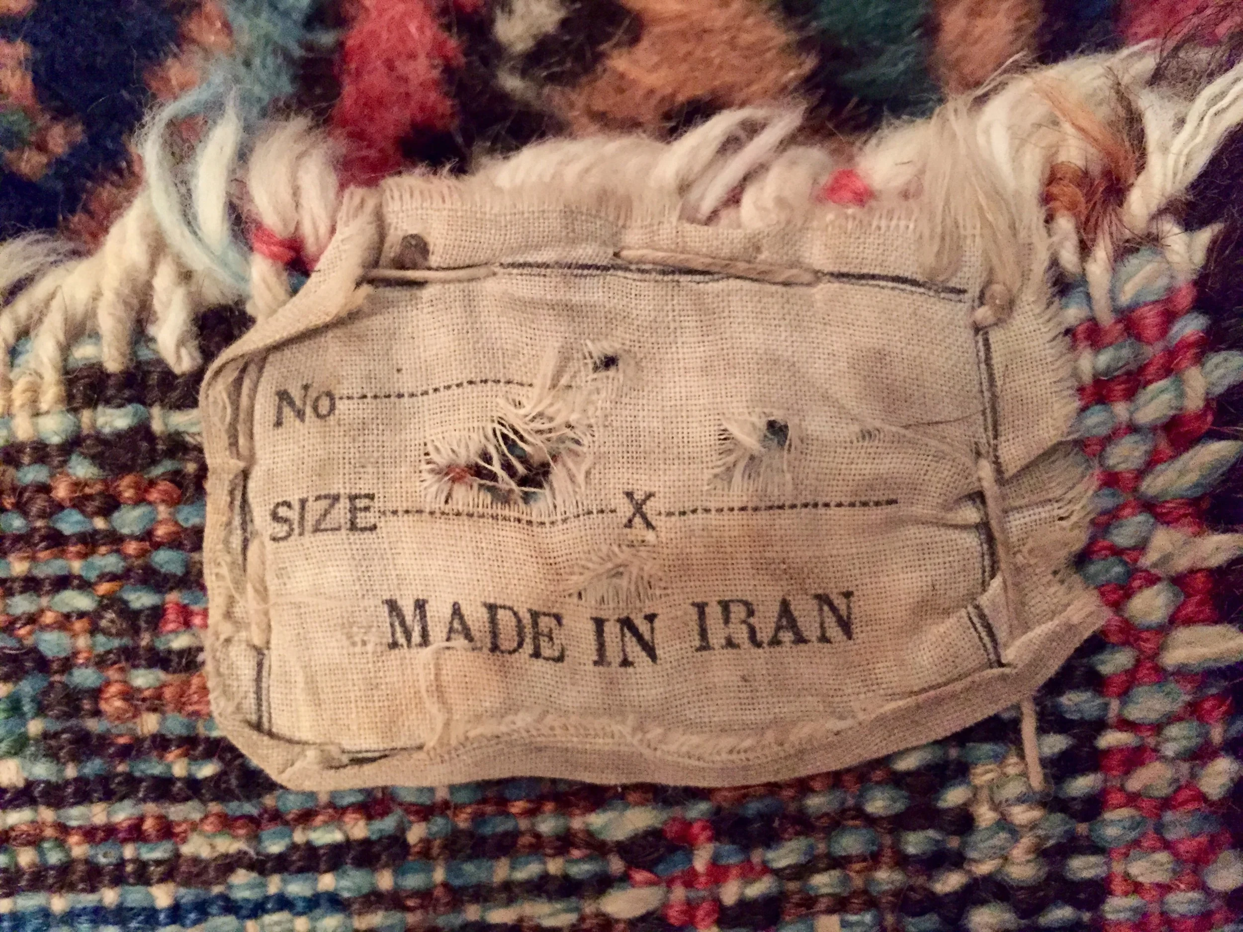Label on back side of rug.