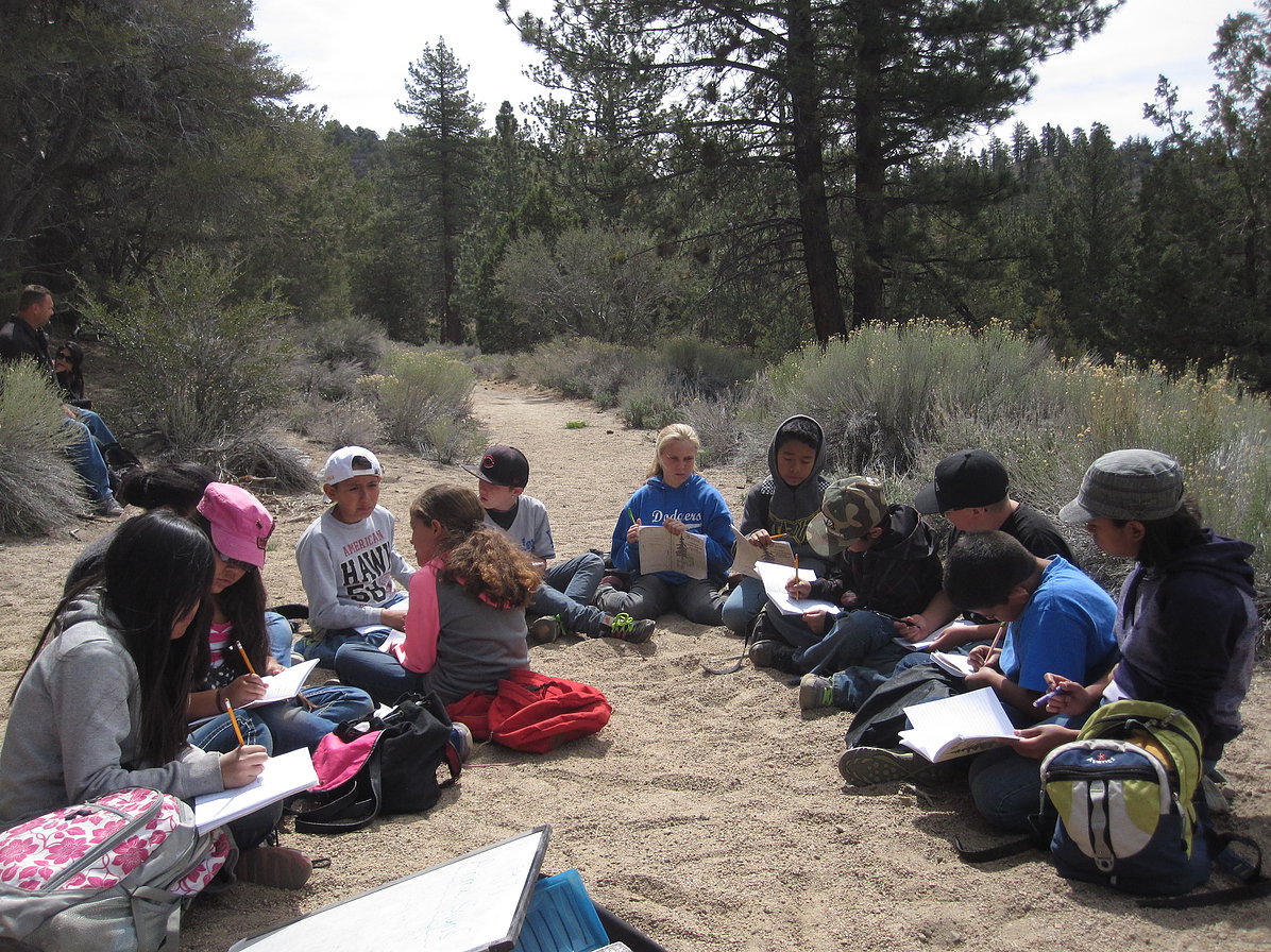 kids writing on trail.jpg