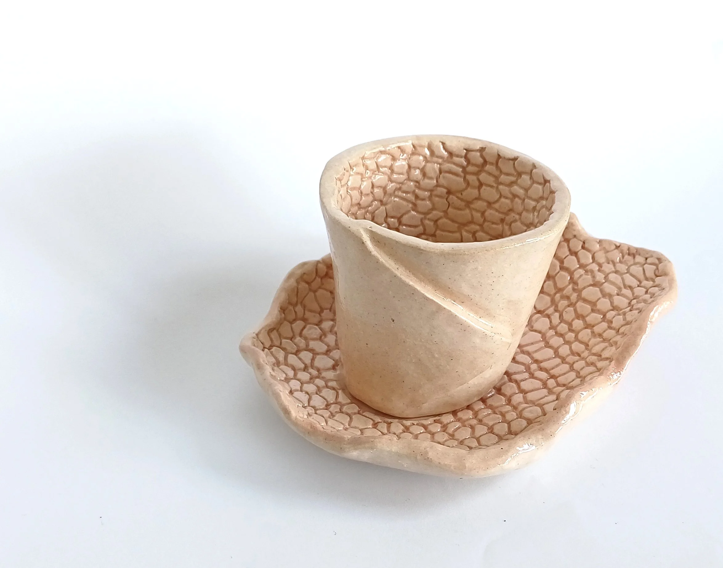 Speckled ivory cup and saucer.jpg