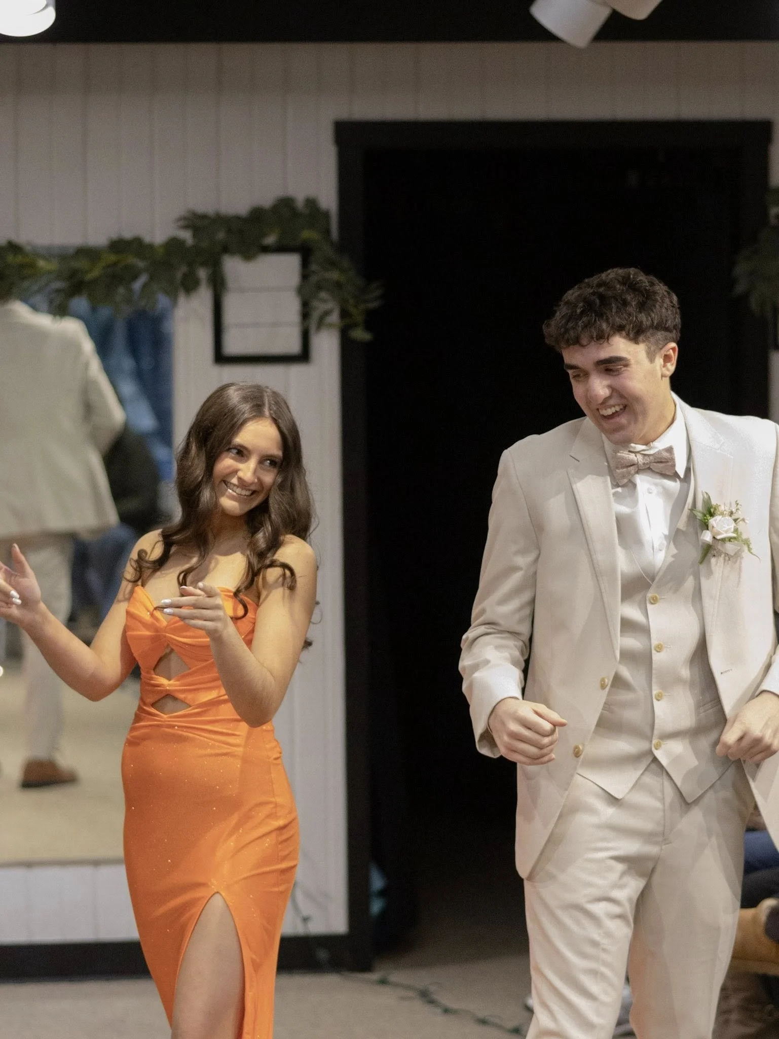 girls wearing prom dresses