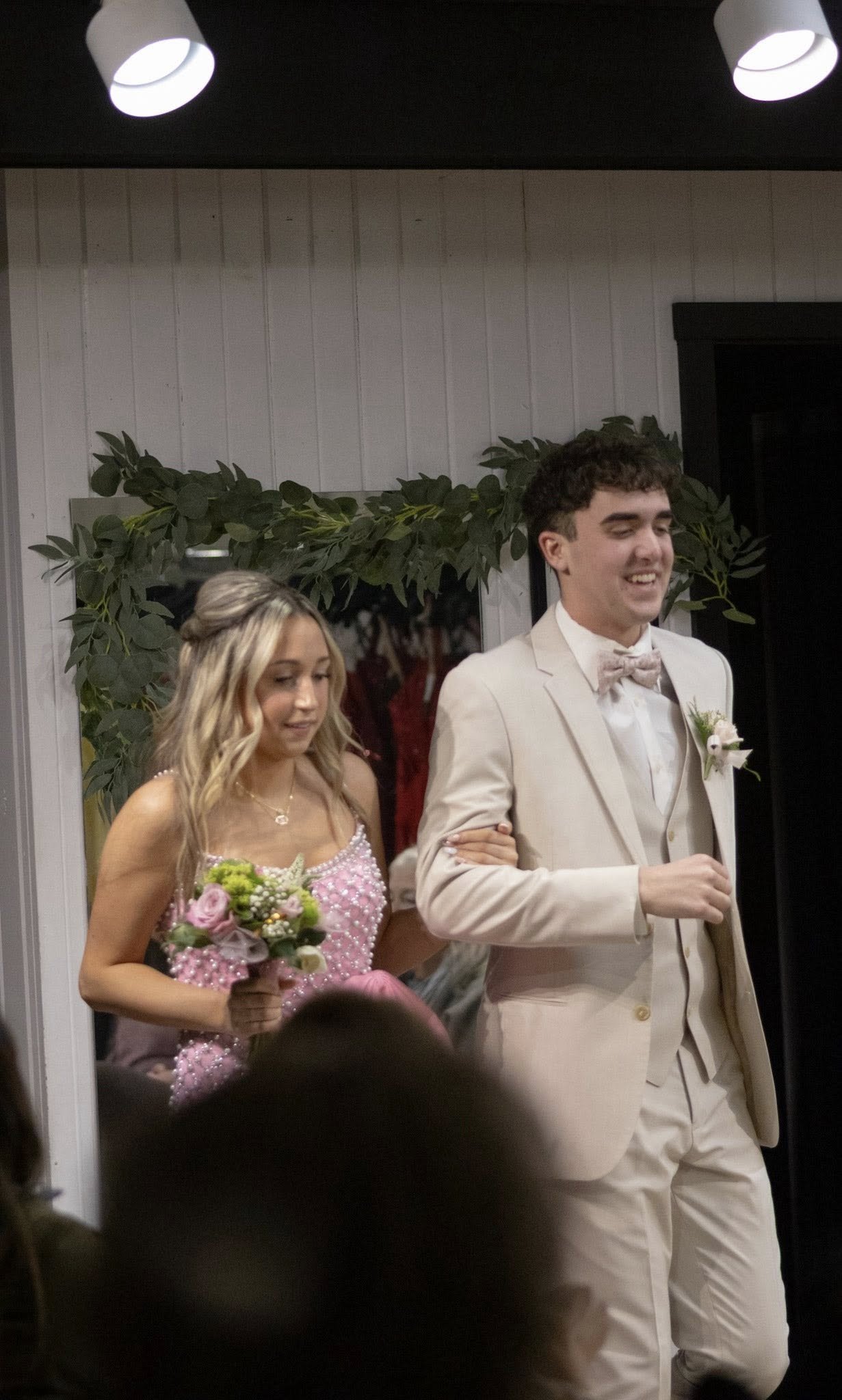 girls wearing prom dresses