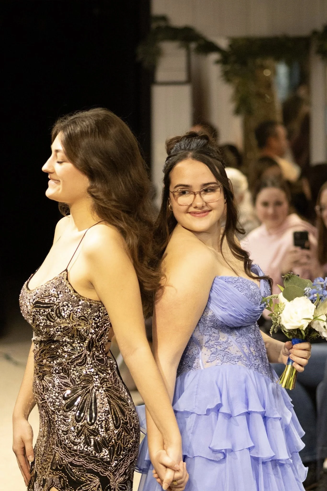 girls wearing prom dresses