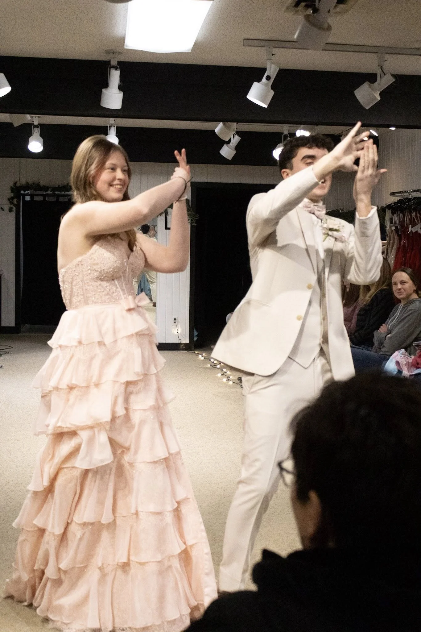 girls wearing prom dresses