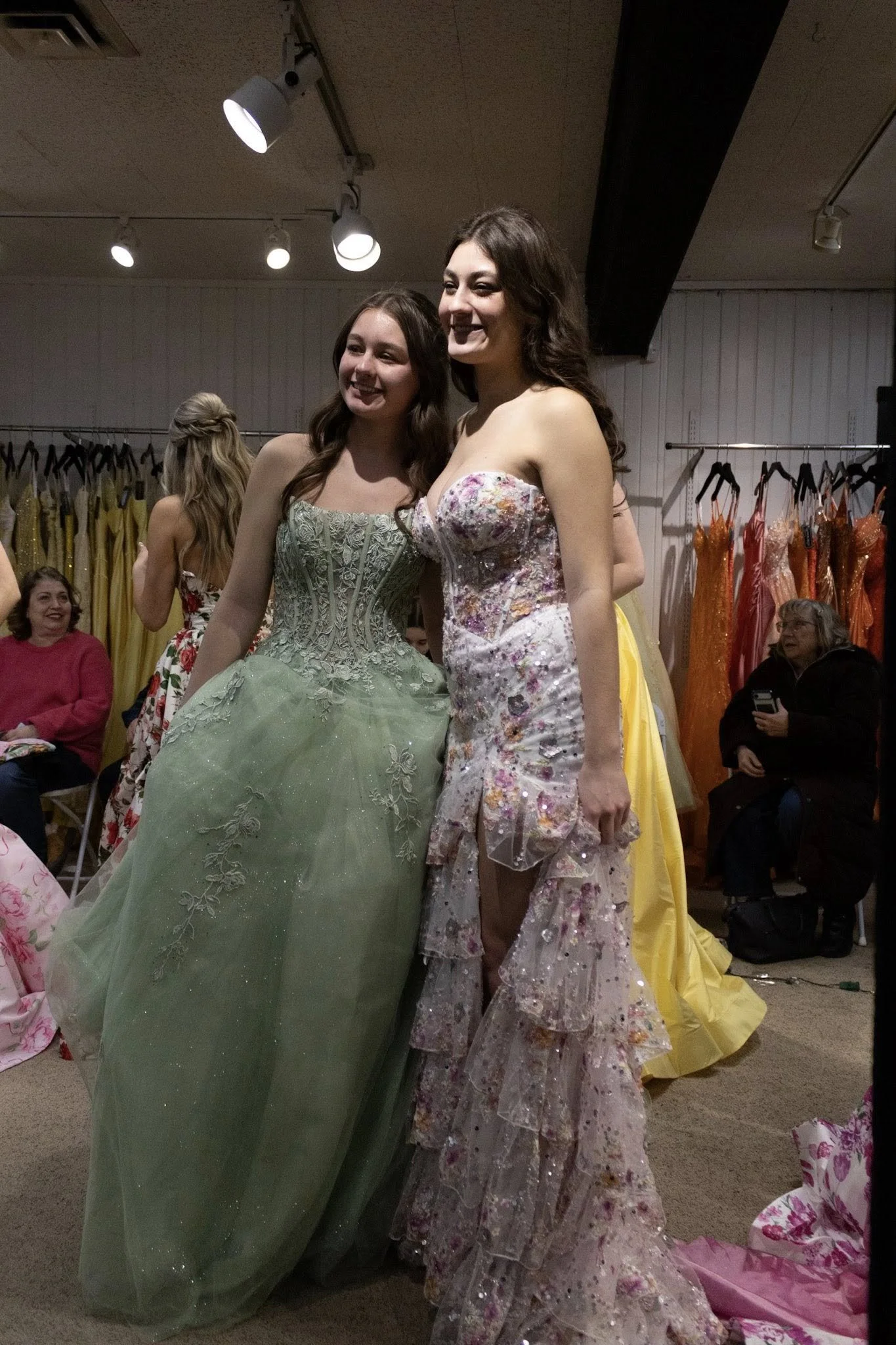 girls wearing prom dresses