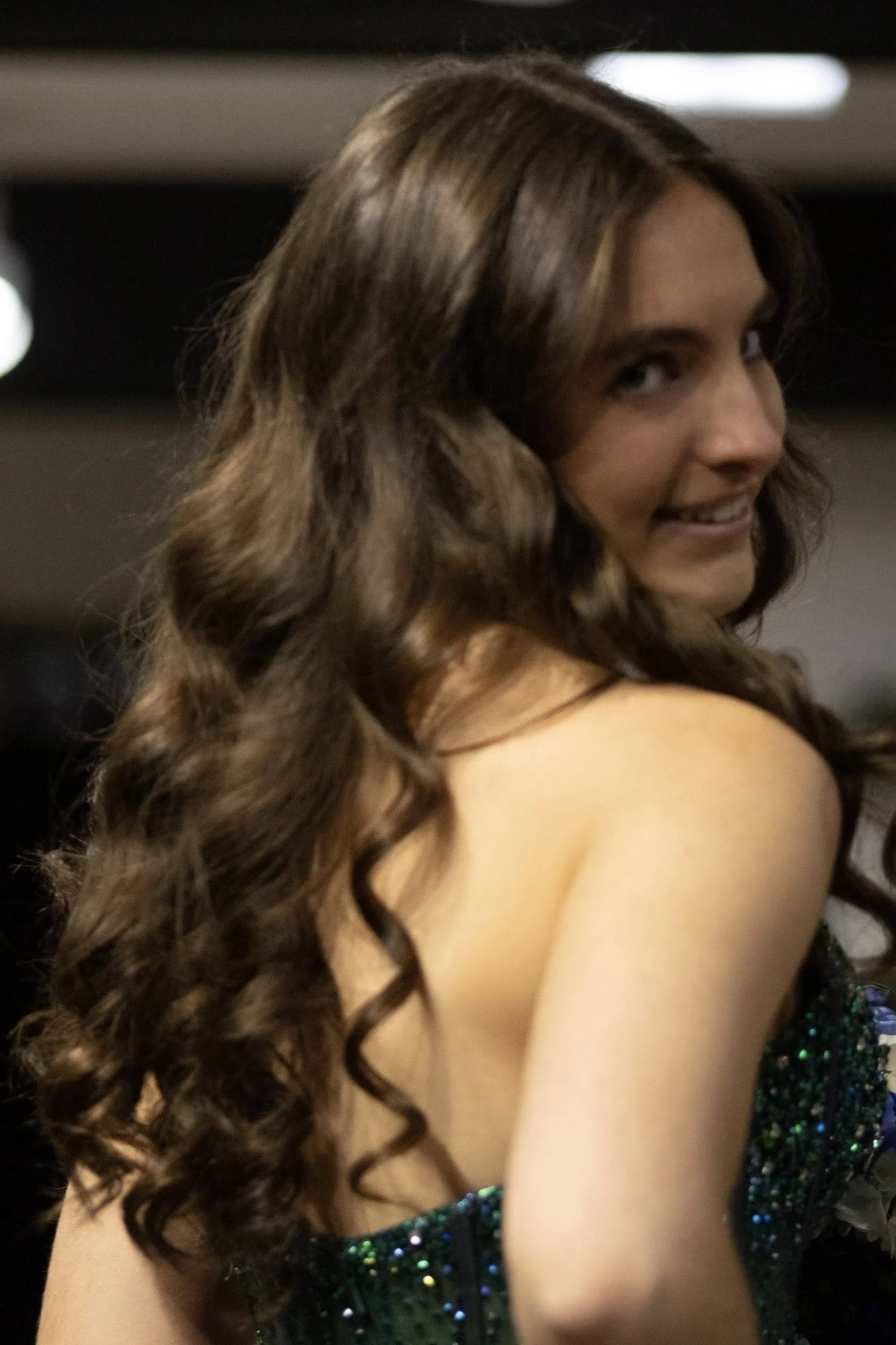 girls wearing prom dresses