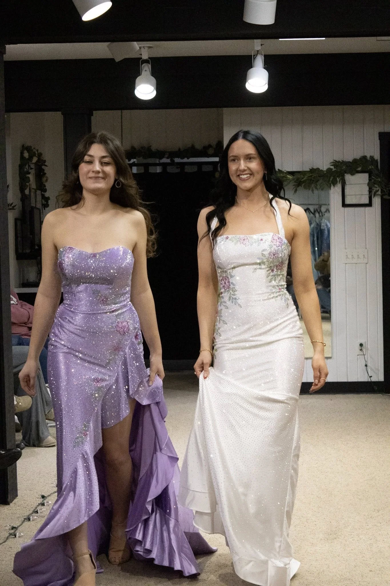 girls wearing prom dresses